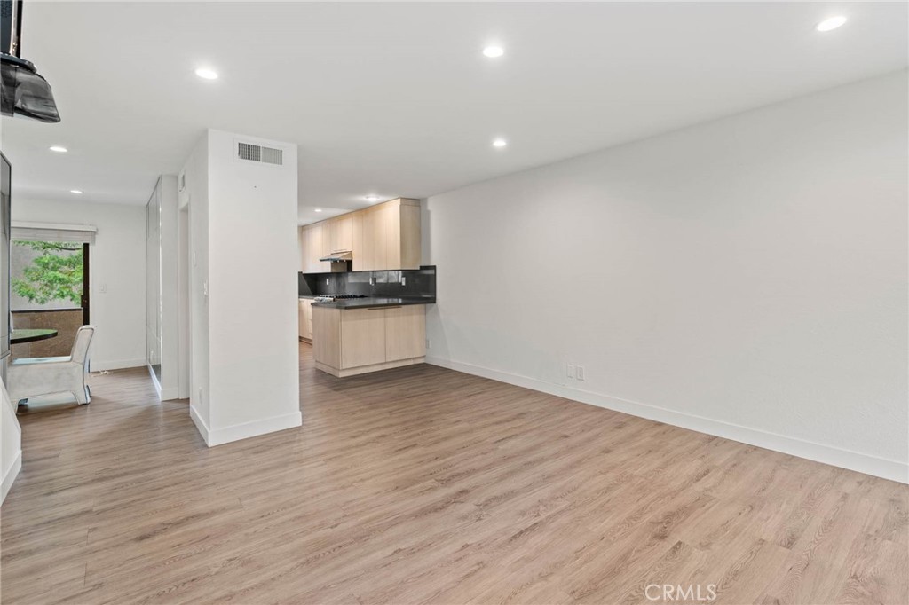 5757 Owensmouth Avenue, Unit 1 Woodland Hills, CA 91367 - Photo 21 of 42 a view of a kitchen with a sink and a stove top oven