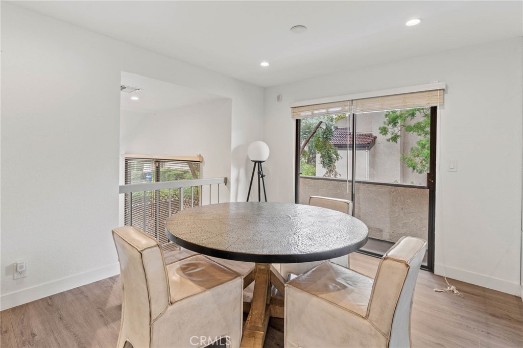 5757 Owensmouth Avenue, Unit 1 Woodland Hills, CA 91367 - Photo 26 of 42 a dining room with furniture and window