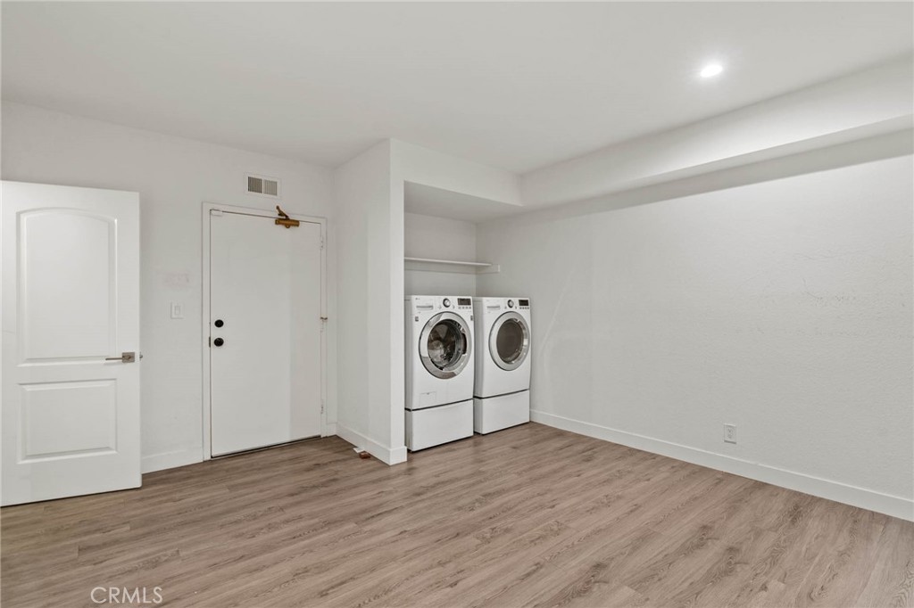 5757 Owensmouth Avenue, Unit 1 Woodland Hills, CA 91367 - Photo 38 of 42 a view of a livingroom with wooden floor