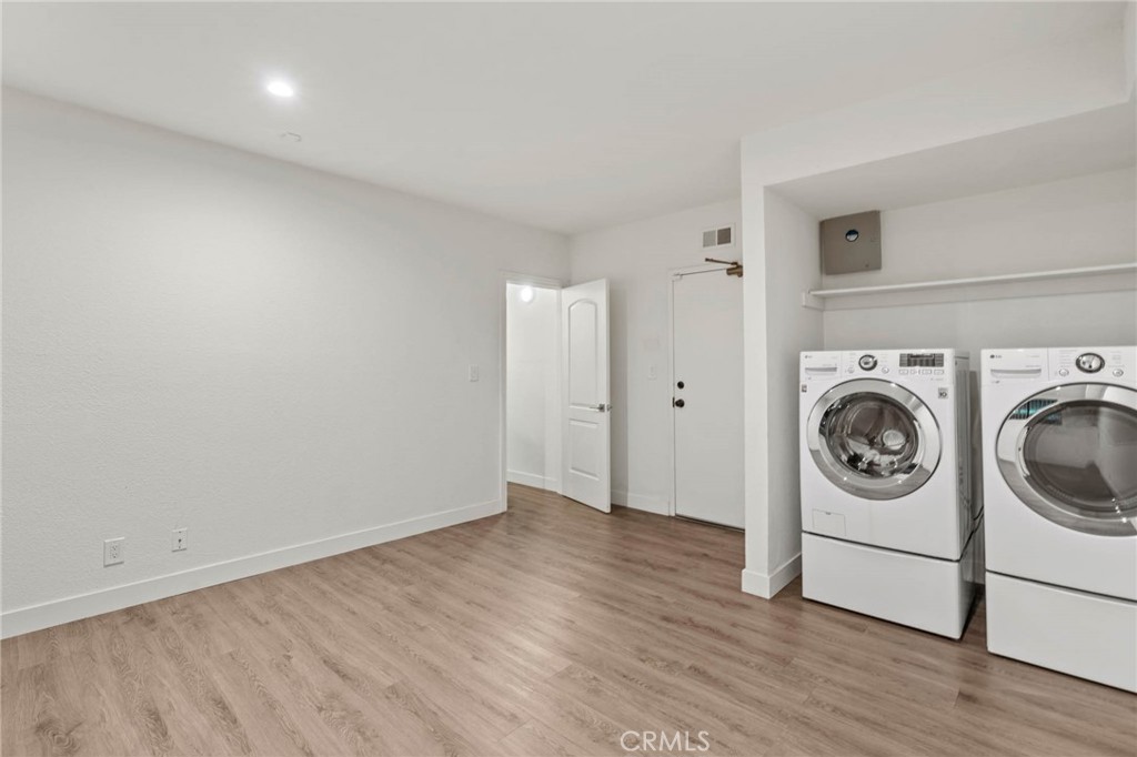 5757 Owensmouth Avenue, Unit 1 Woodland Hills, CA 91367 - Photo 39 of 42 a view of a storage & utility room with washer and dryer