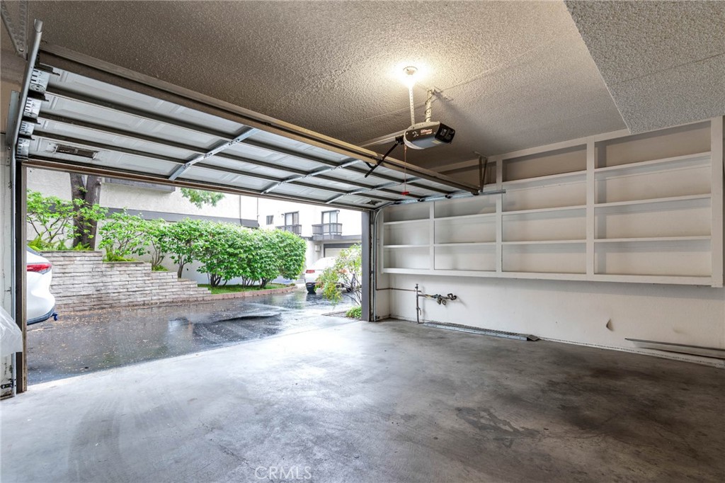 5757 Owensmouth Avenue, Unit 1 Woodland Hills, CA 91367 - Photo 40 of 42 a view of a room with garage and a window
