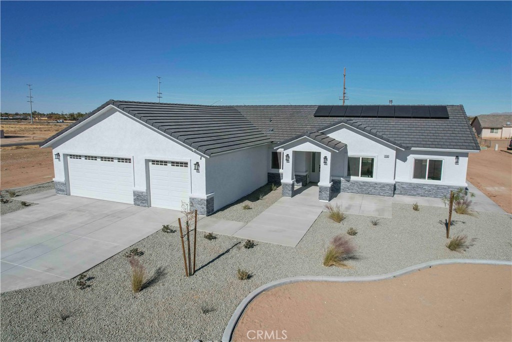 21282 Laguna Road Apple Valley, CA 92308 - Photo 1 of 1 a view of a house with a tub