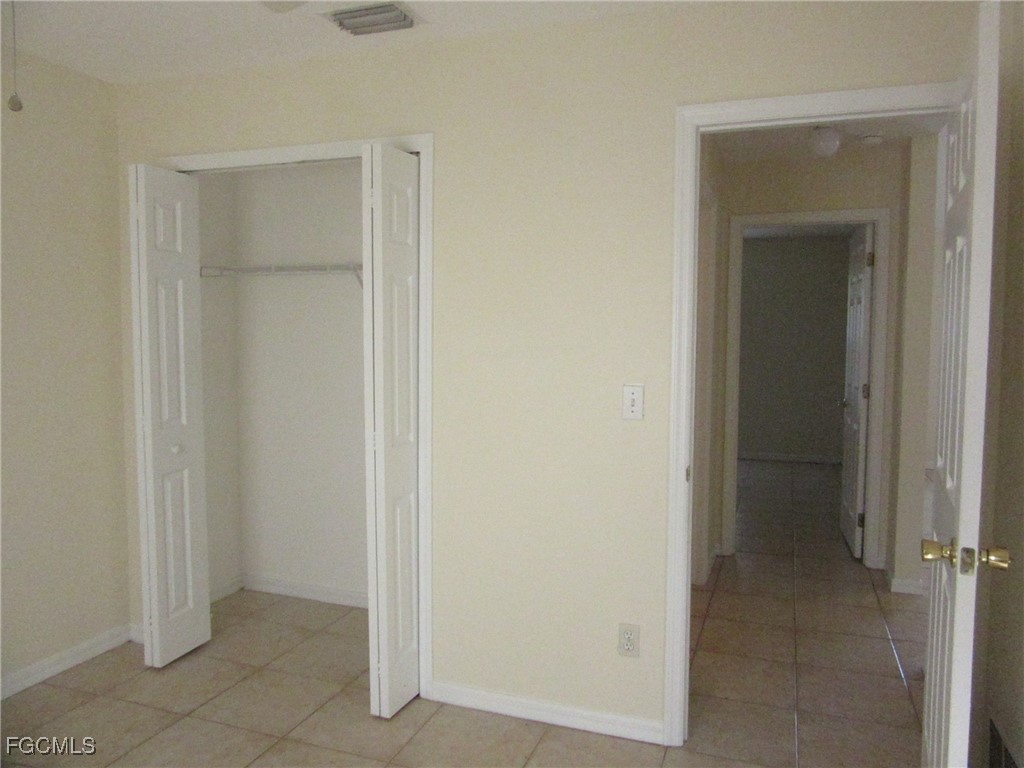4546 28th Street Southwest Lehigh Acres, FL 33973 - Photo 6 of 9 a view of an empty room