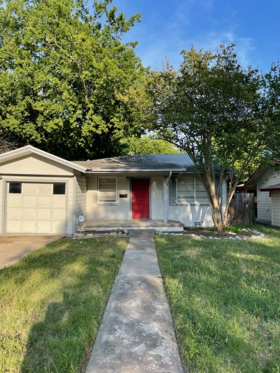 5409 Sunshine Drive Austin, TX 78756 - Photo 1 of 1 a front view of a house with a yard and trees