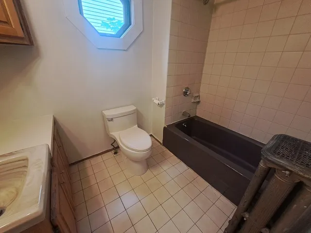 a bathroom with a toilet and a sink