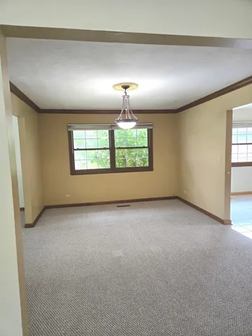 an empty room with windows and windows
