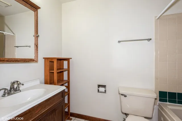 a view of a sink and dishwasher with wooden floor