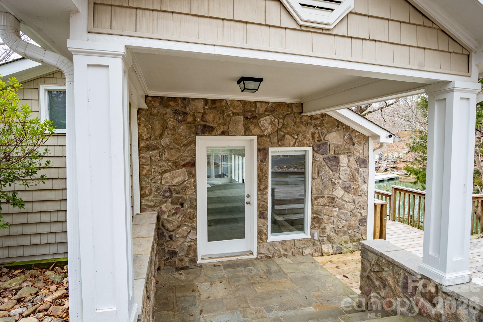 a front view of a house with a glass door