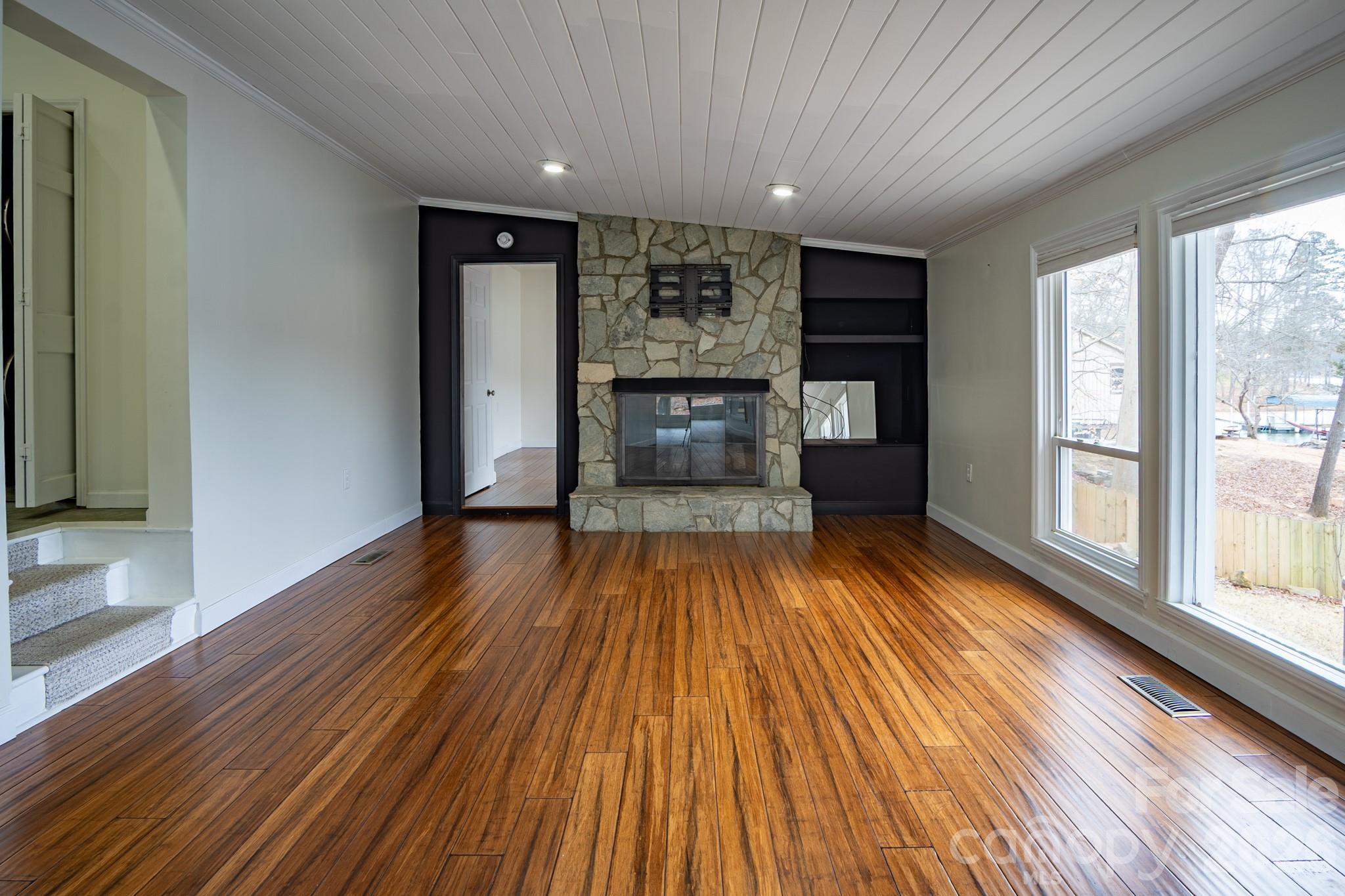 208 Island View Road Mount Holly, NC 28120 - Photo 33 of 37 wooden floor in an empty room with a window