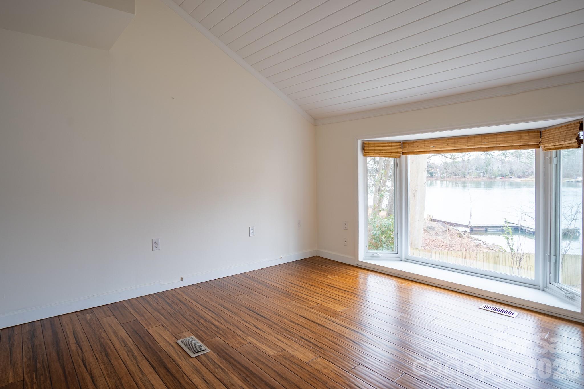 208 Island View Road Mount Holly, NC 28120 - Photo 35 of 37 a view of an empty room with wooden floor and a window