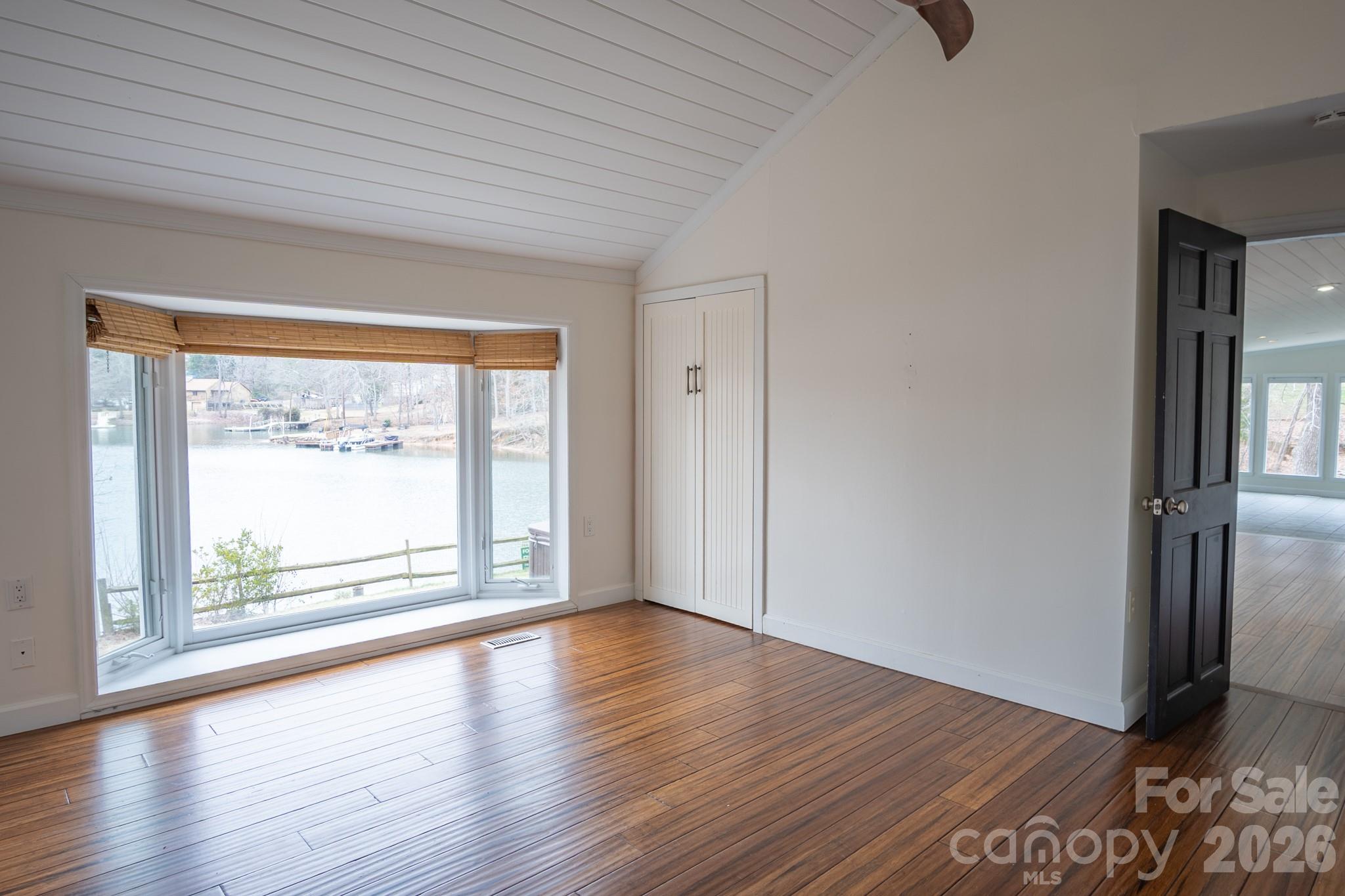 208 Island View Road Mount Holly, NC 28120 - Photo 36 of 37 an empty room with wooden floor and windows