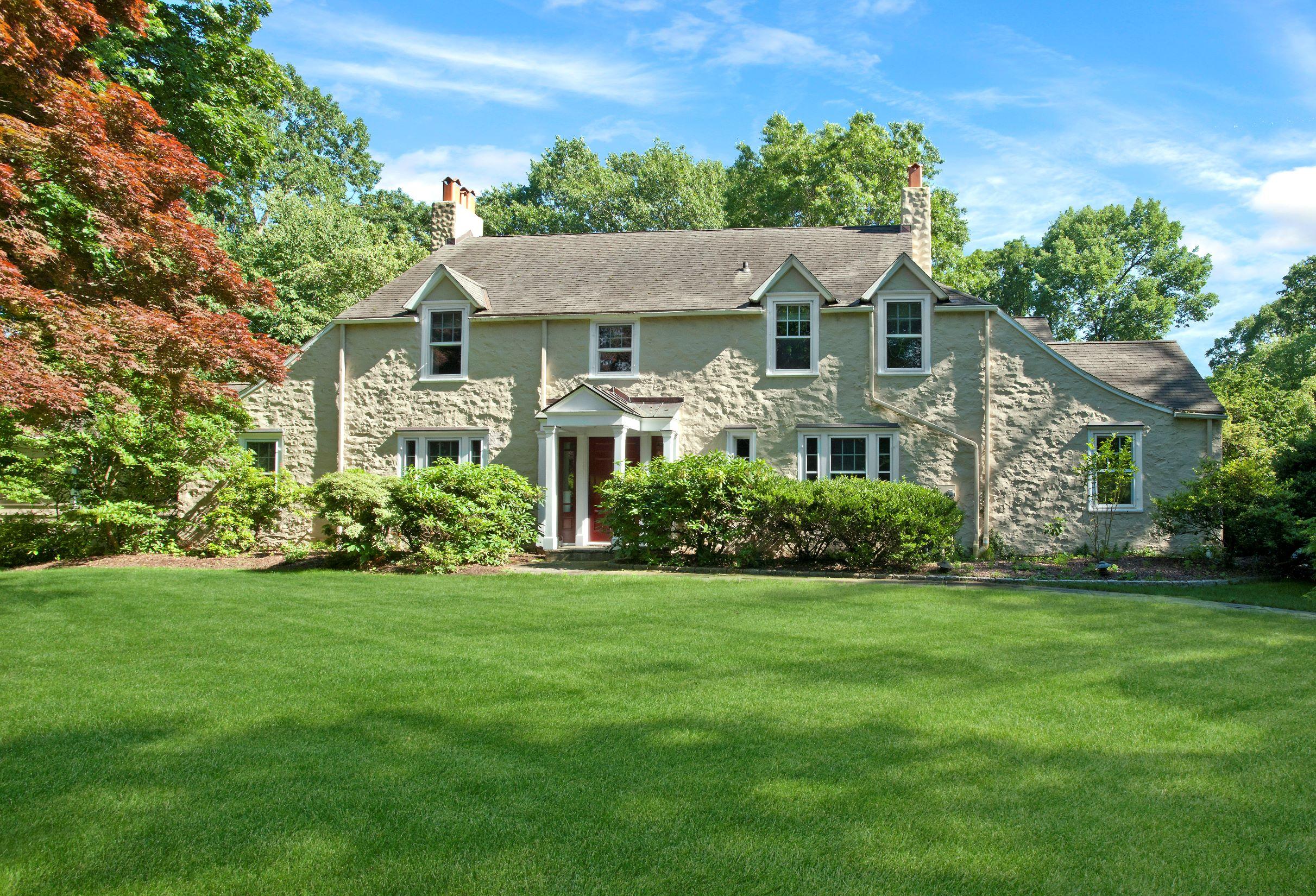 58 Locust Hill Road Darien, CT 06820 - Photo 1 of 21 a front view of a house with a garden