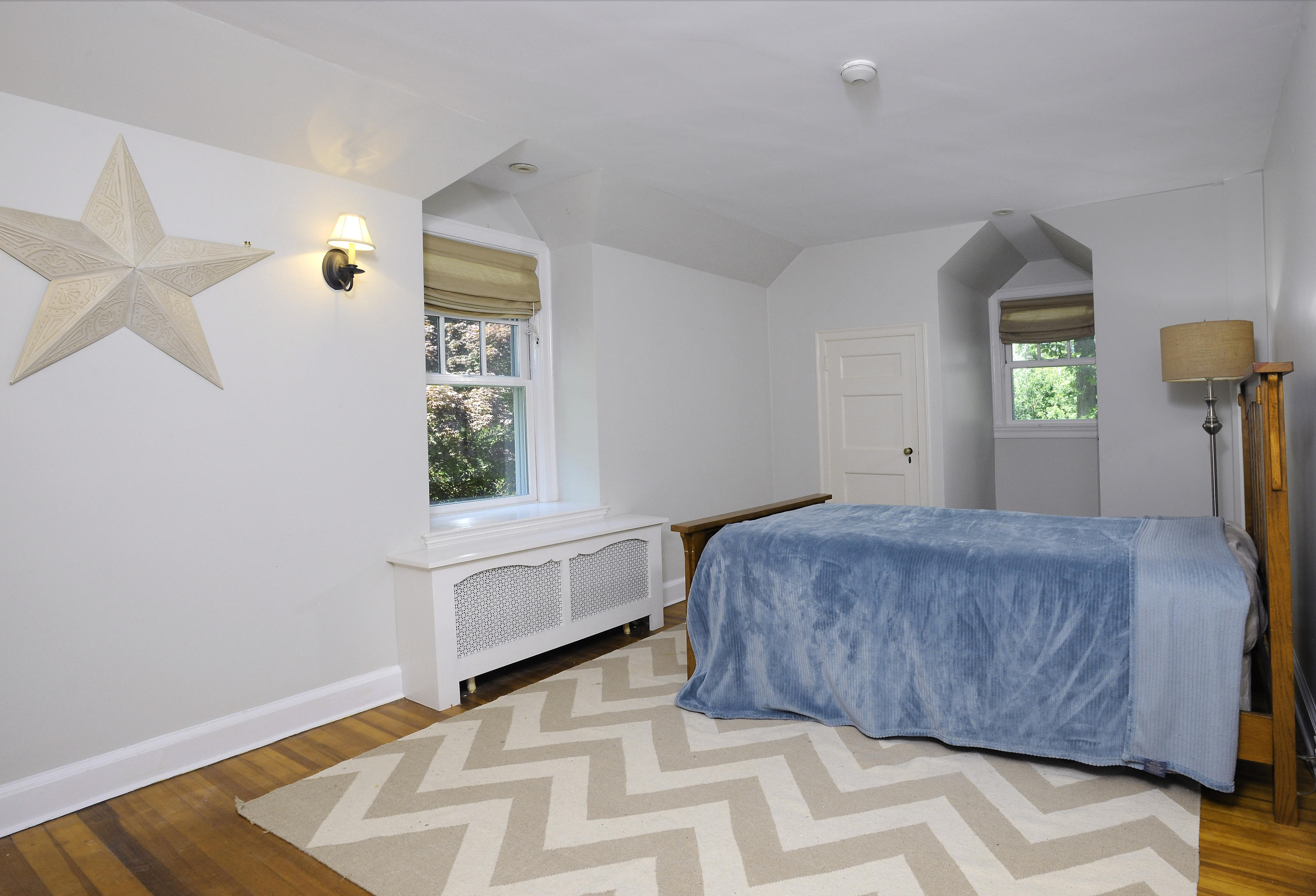 58 Locust Hill Road Darien, CT 06820 - Photo 12 of 21 a bedroom with a bed and a window