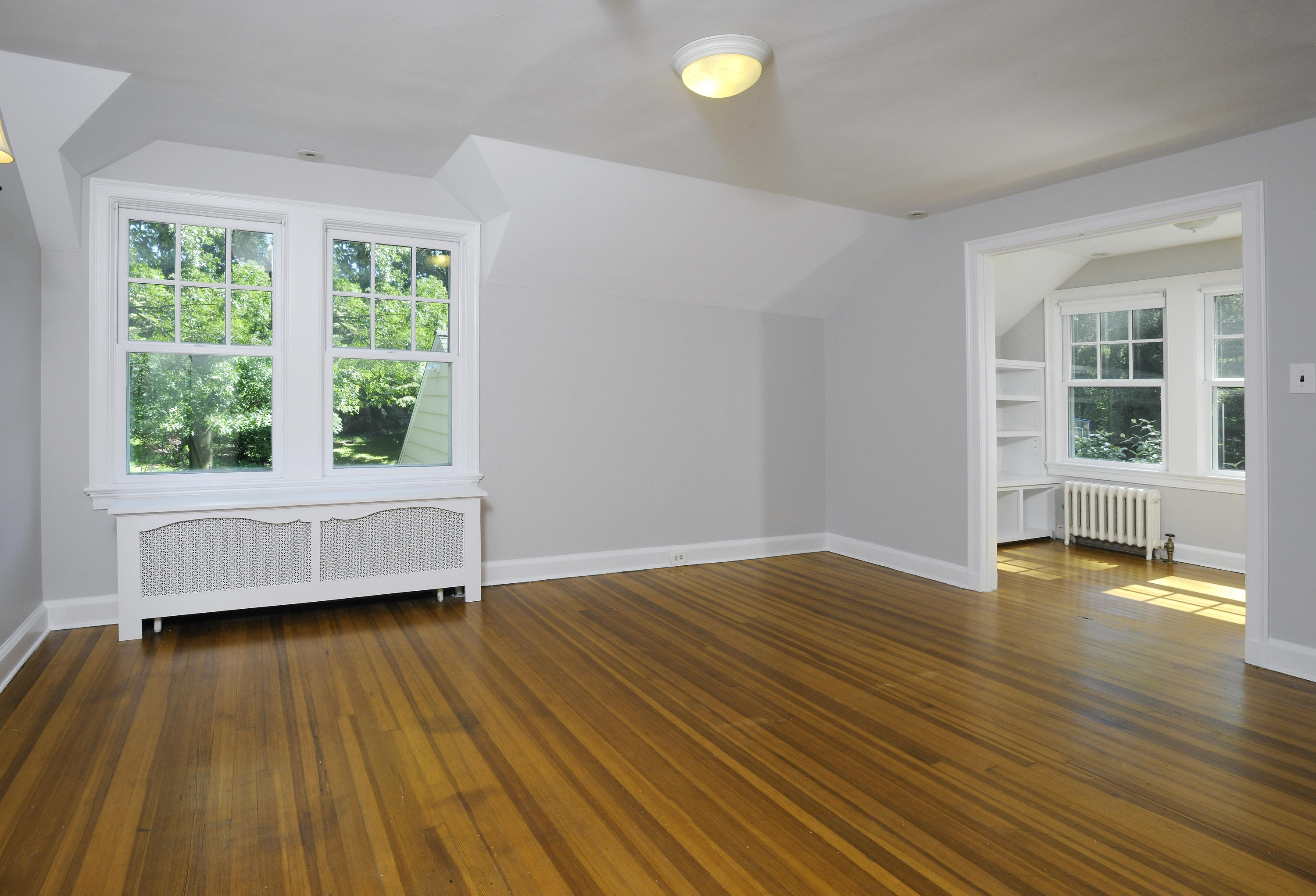 58 Locust Hill Road Darien, CT 06820 - Photo 13 of 21 a view of an empty room with wooden floor and a window
