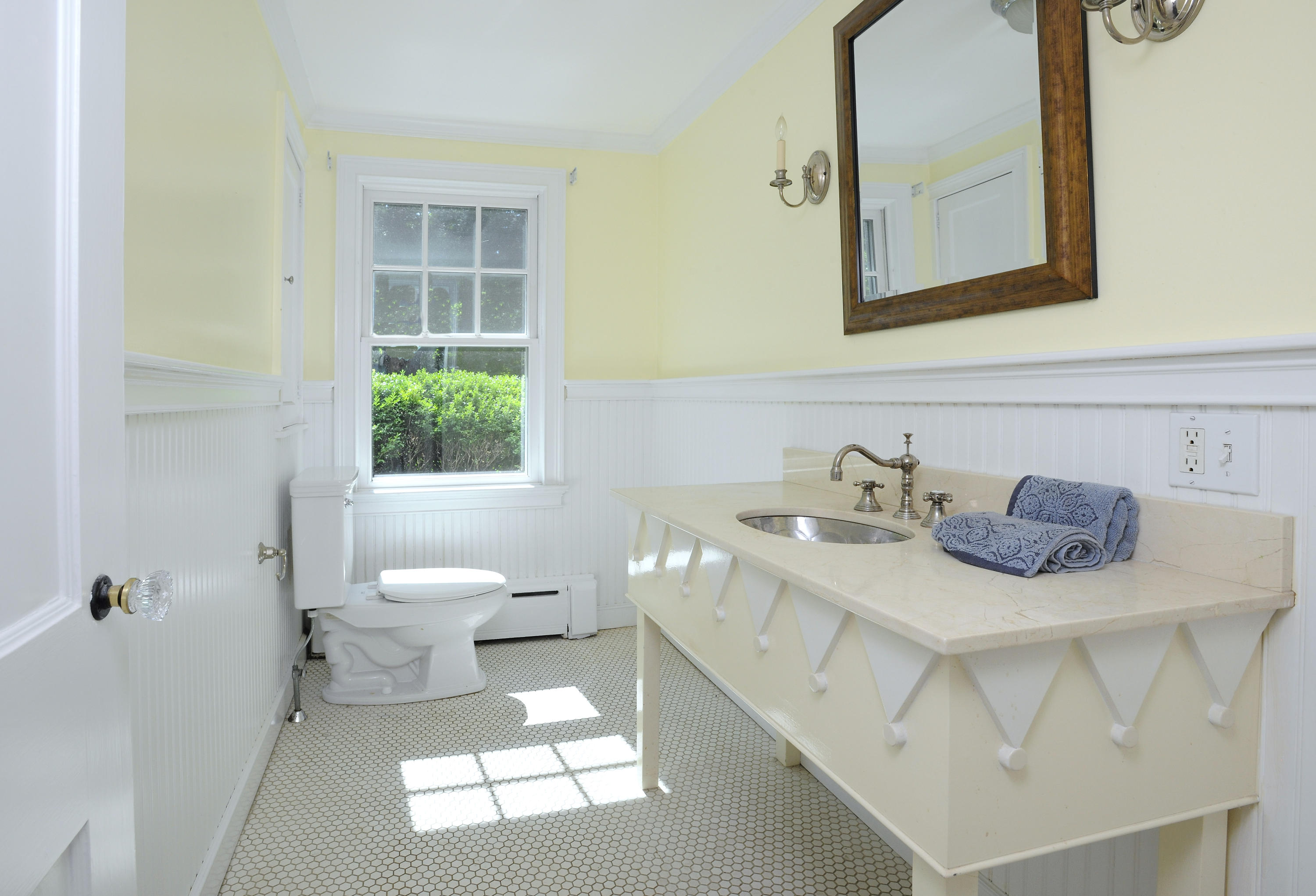 58 Locust Hill Road Darien, CT 06820 - Photo 14 of 21 a bathroom with a sink toilet and mirror