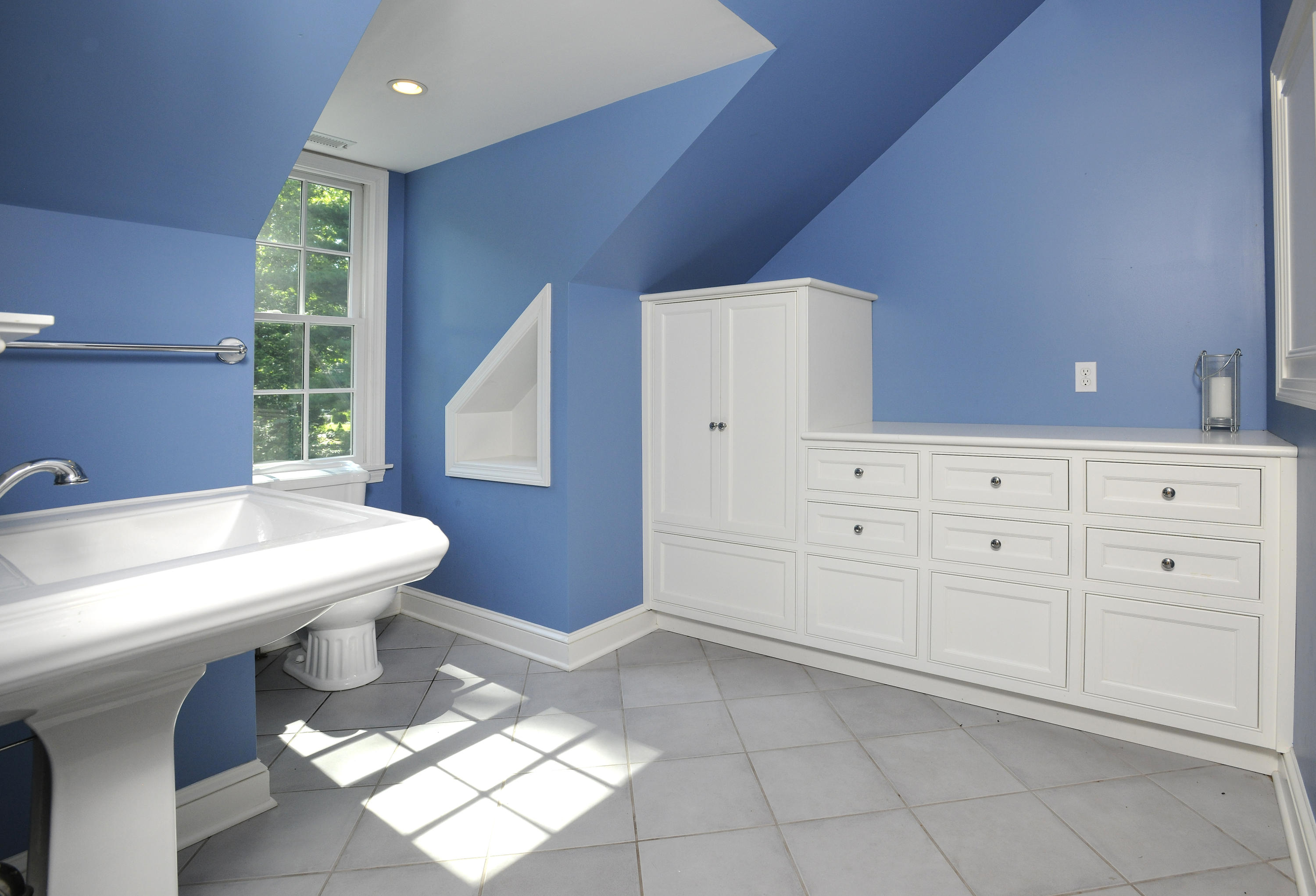58 Locust Hill Road Darien, CT 06820 - Photo 16 of 21 a bathroom with a sink a toilet and a window