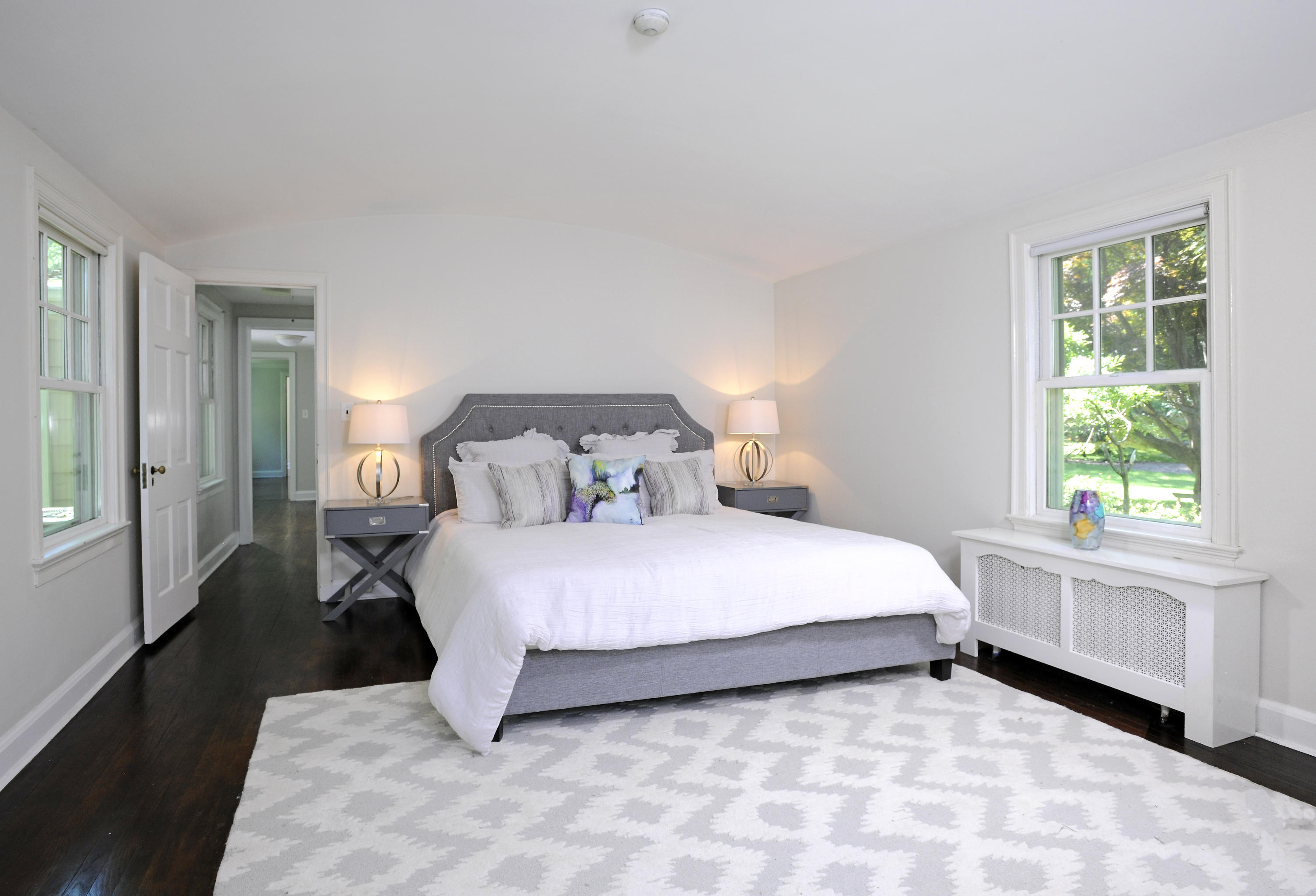 58 Locust Hill Road Darien, CT 06820 - Photo 10 of 21 a bedroom with a bed and a window