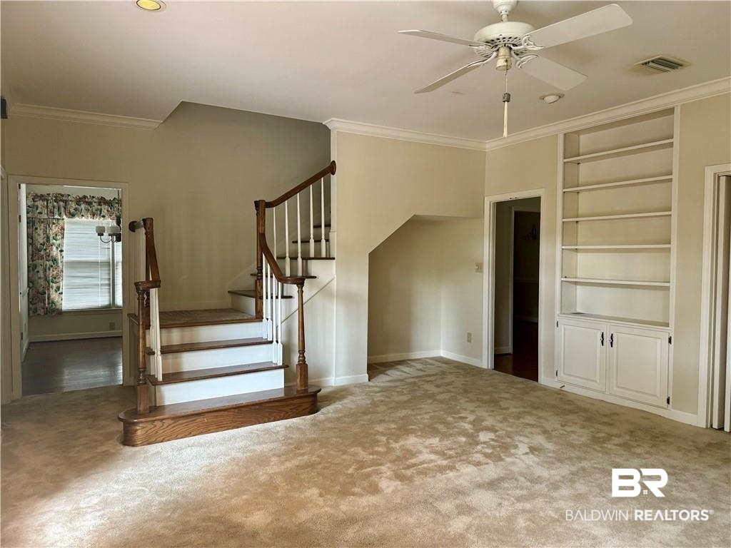3932 Mcgregor Court Mobile, AL 36608 - Photo 3 of 9 Stairs featuring carpet, ornamental molding, and ceiling fan