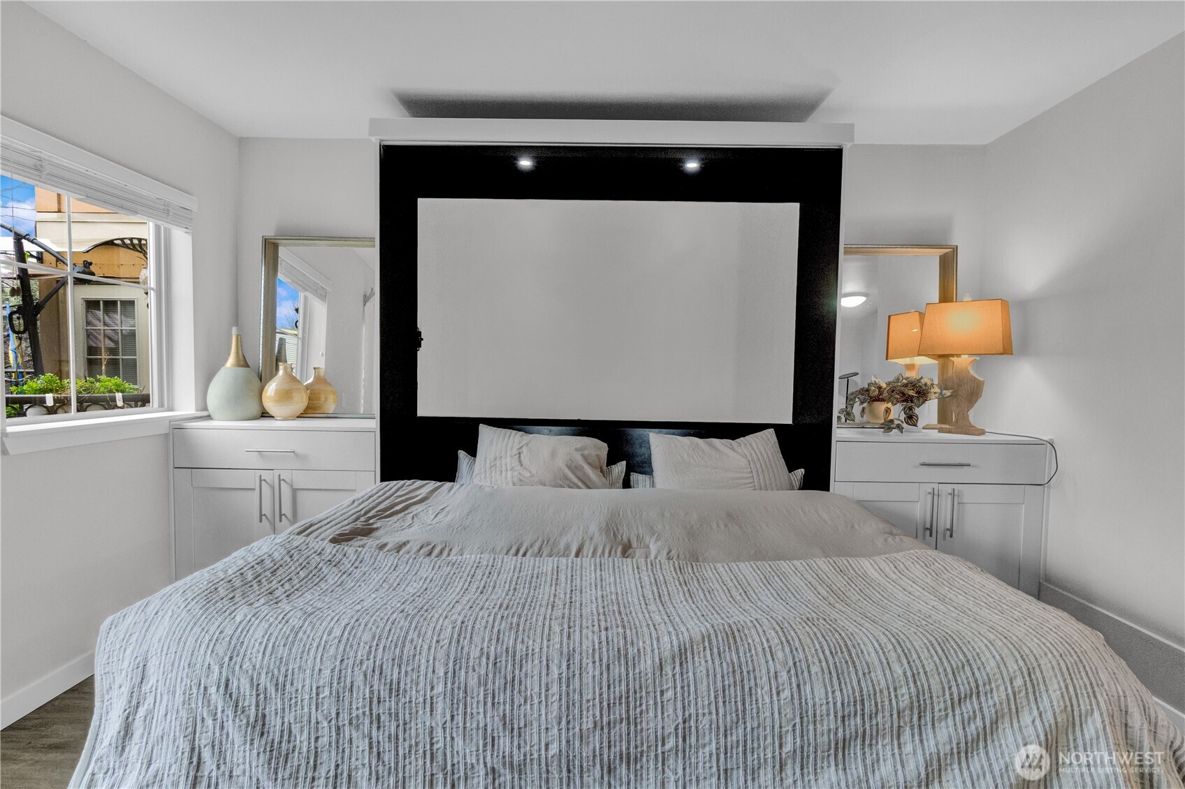 1125 East Olive Street, Unit 212 Seattle, WA 98122 - Photo 12 of 39 a bedroom with a bed and a lamp on table