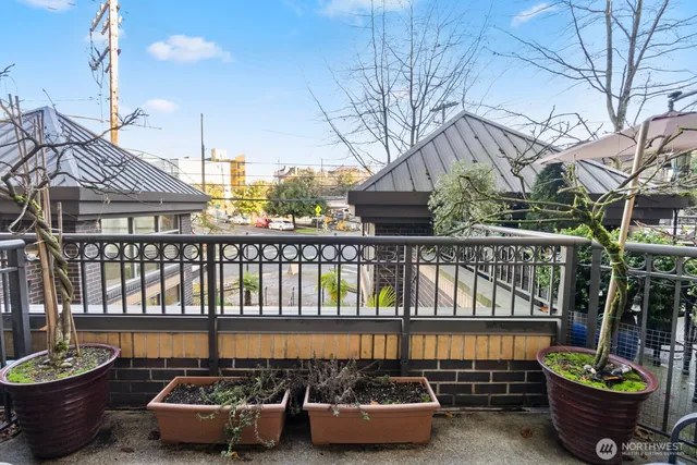a view of a chairs and tables in the balcony