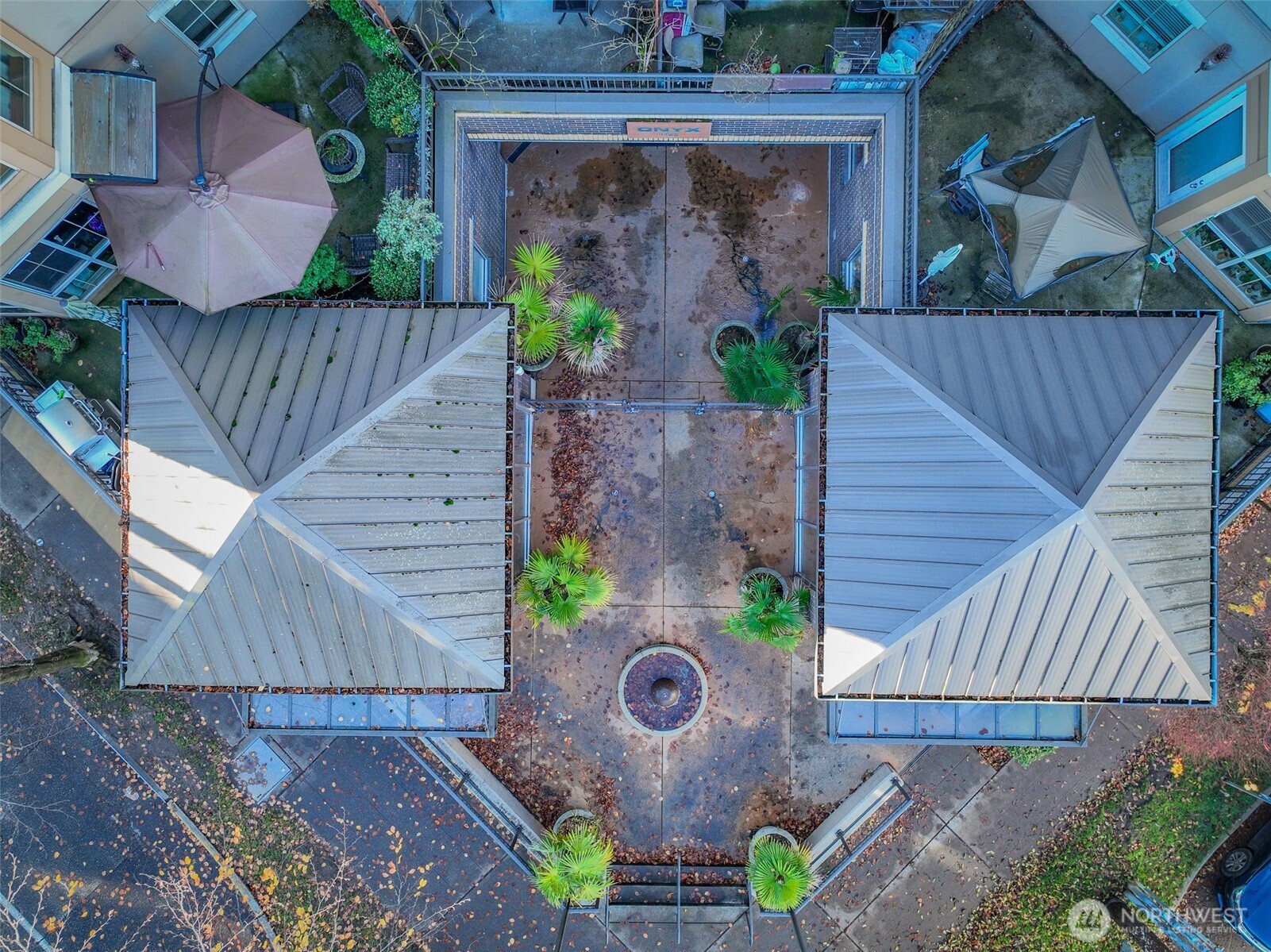 1125 East Olive Street, Unit 212 Seattle, WA 98122 - Photo 33 of 39 a view of a backyard with a tub and potted plants
