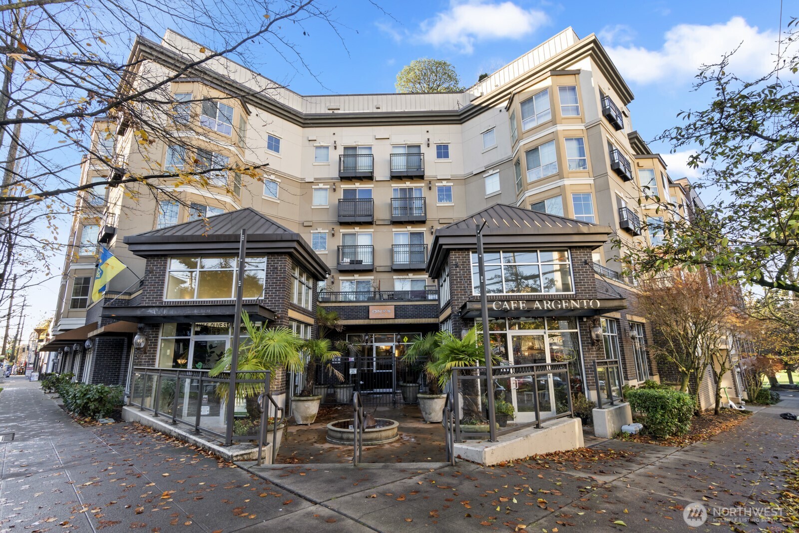 1125 East Olive Street, Unit 212 Seattle, WA 98122 - Photo 35 of 39 a view of a brick building with many windows