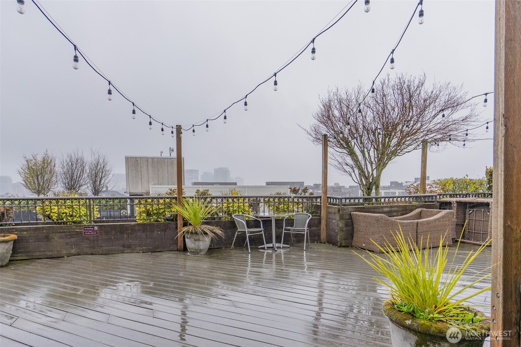 1125 East Olive Street, Unit 212 Seattle, WA 98122 - Photo 37 of 39 a view of a swimming pool with outdoor seating