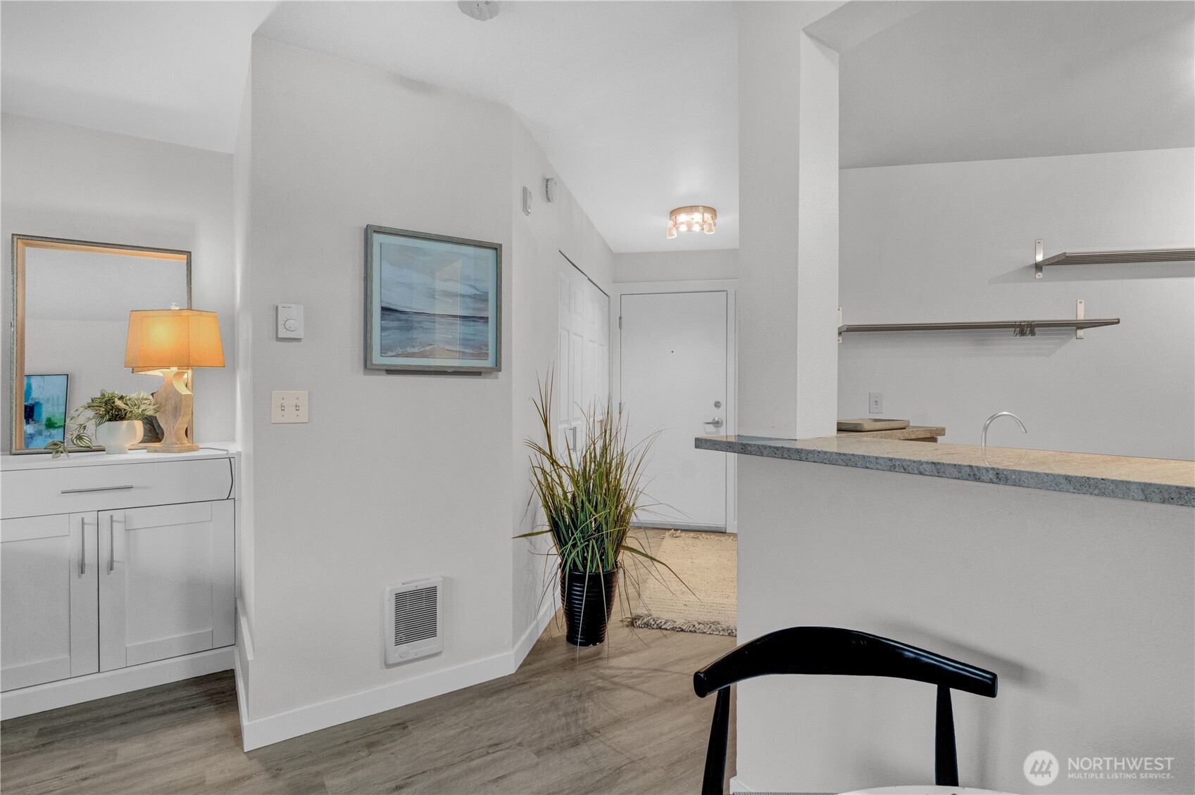 1125 East Olive Street, Unit 212 Seattle, WA 98122 - Photo 7 of 39 a view of entryway with wooden floor