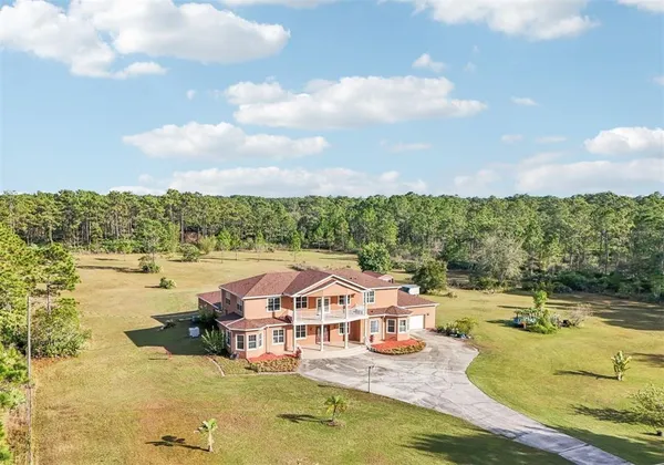 swimming pool with outdoor seating and barbeque oven