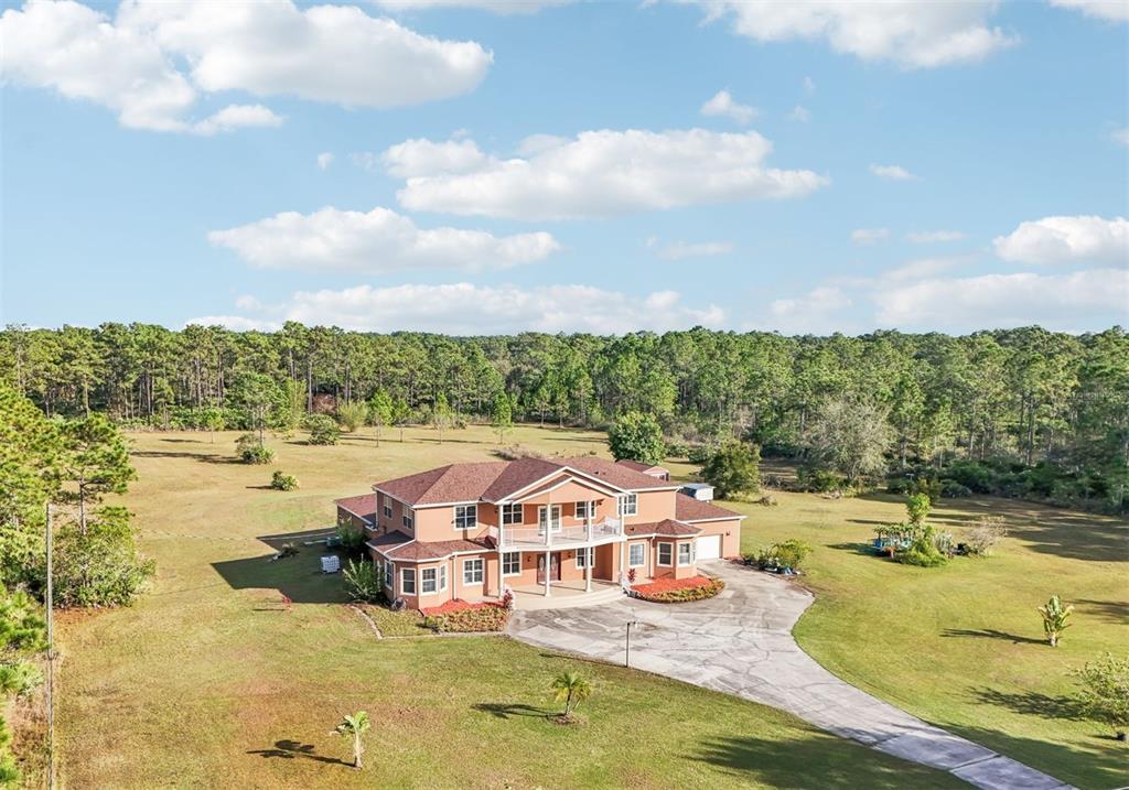 swimming pool with outdoor seating and barbeque oven