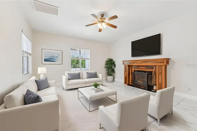 a living room with furniture or couch and a potted plant