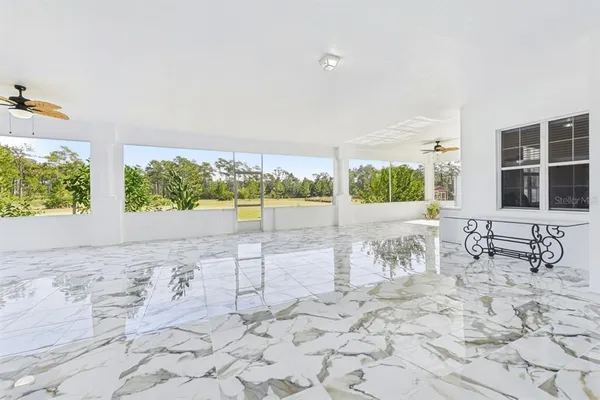 a bedroom with bed and a chandelier