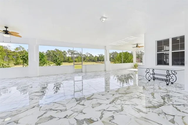 a bedroom with bed and a chandelier