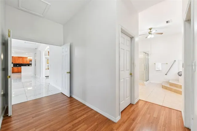 a bathroom with a tub a sink a window and a mirror