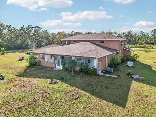 a view of a house with a big yard