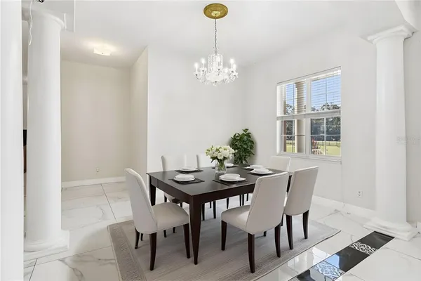 a kitchen with stainless steel appliances kitchen island granite countertop a refrigerator and a stove top oven