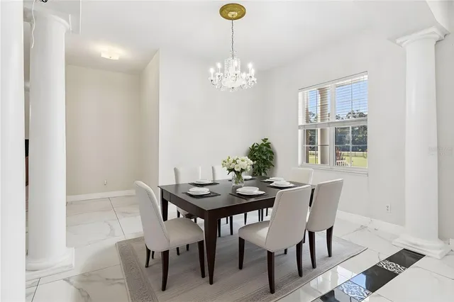 a kitchen with stainless steel appliances kitchen island granite countertop a refrigerator and a stove top oven