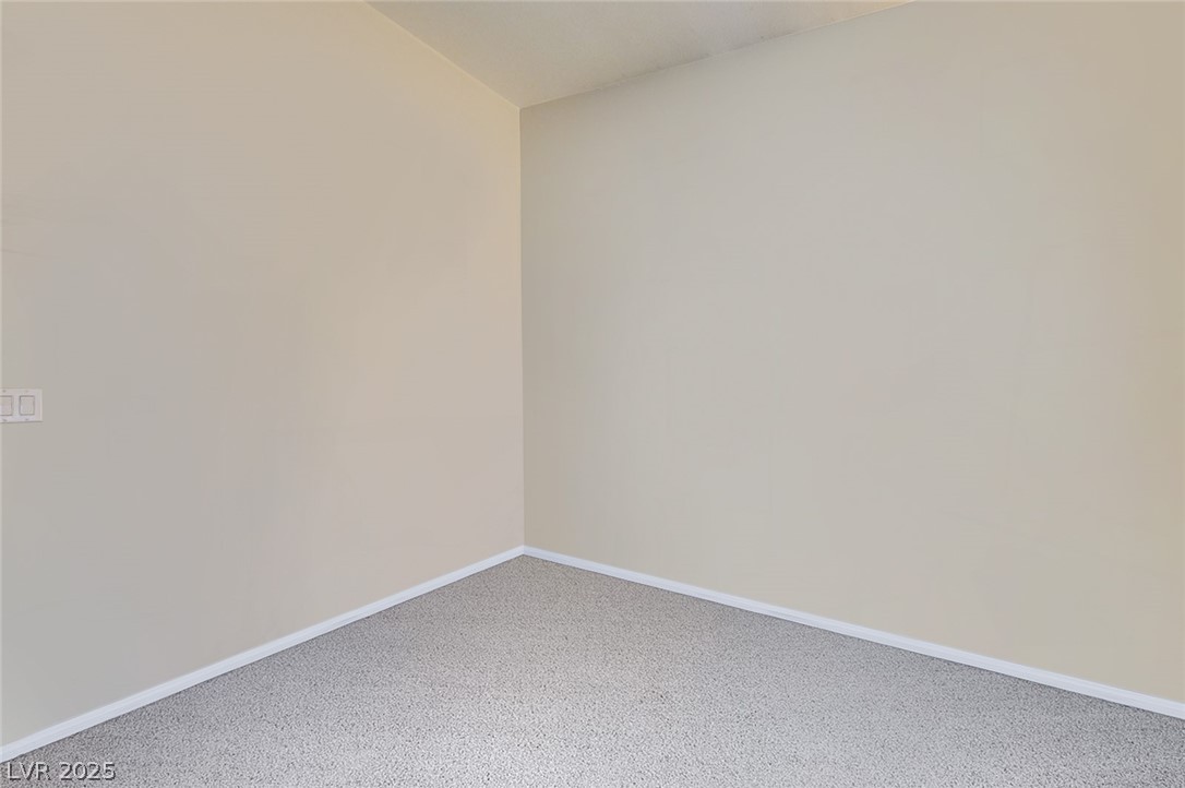 2305 West Horizon Ridge Parkway, Unit 1223 Henderson, NV 89052 - Photo 22 of 28 Carpeted empty room with baseboards