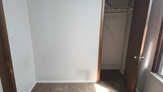 a kitchen with cabinets appliances and a window