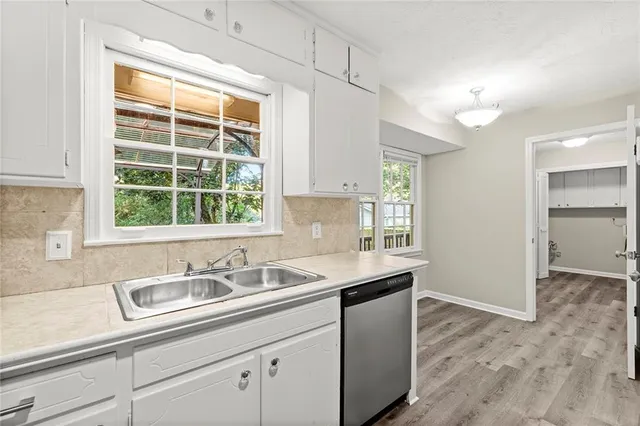 a kitchen with a sink and a window