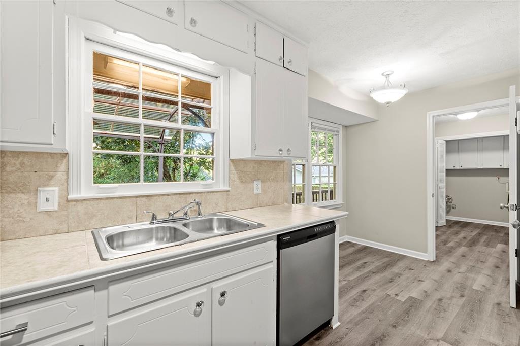 410 Milton Avenue Alpharetta, GA 30009 - Photo 12 of 42 a kitchen with a sink and a window