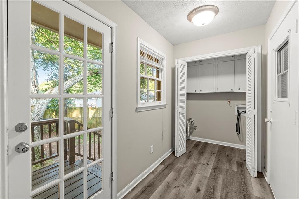 410 Milton Avenue Alpharetta, GA 30009 - Photo 19 of 42 a view of an entryway with wooden floor and windows