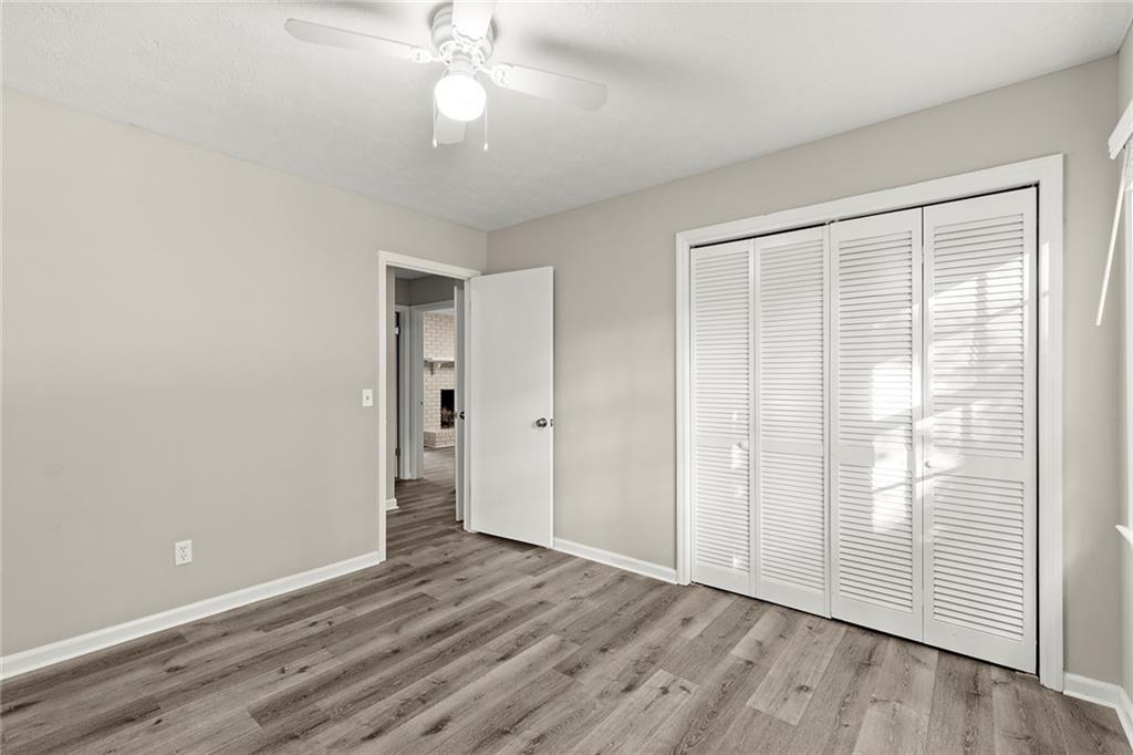 410 Milton Avenue Alpharetta, GA 30009 - Photo 25 of 42 a view of an empty room with wooden floor and a window