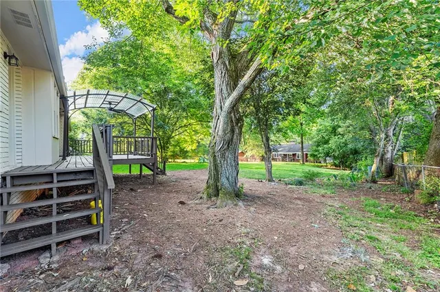 a backyard of a house with lots of green space