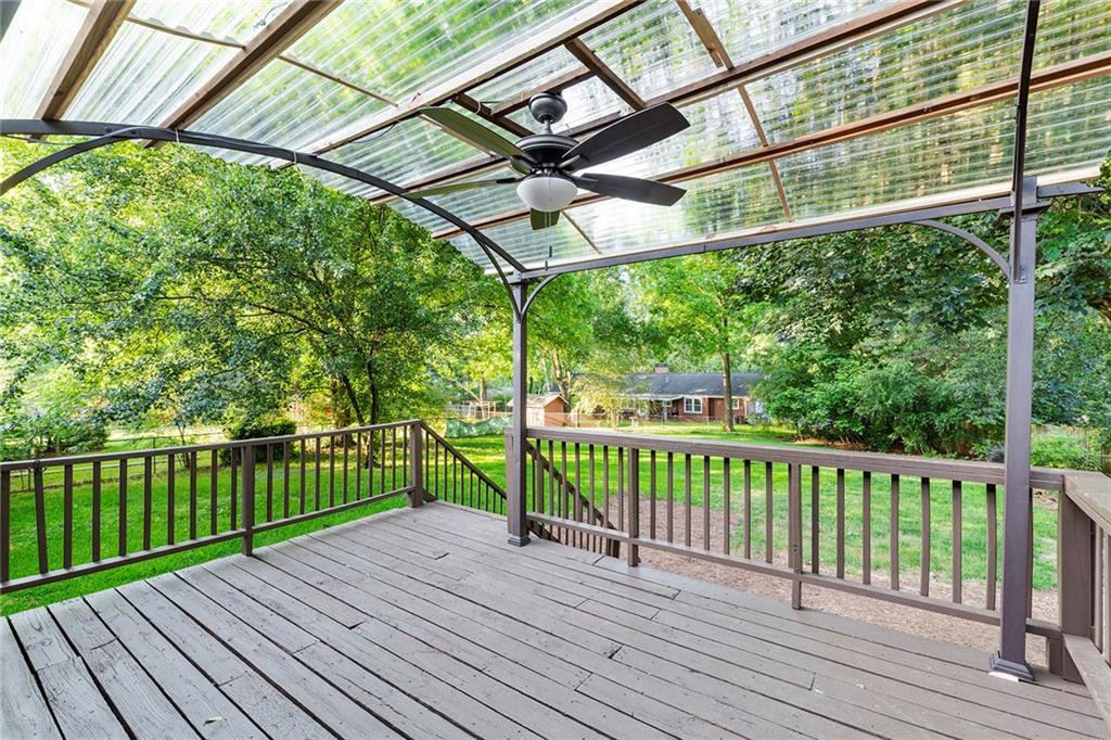410 Milton Avenue Alpharetta, GA 30009 - Photo 4 of 42 a view of a wooden deck