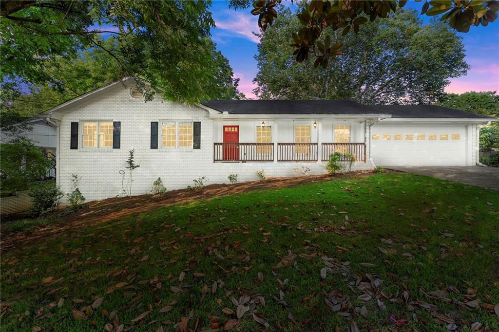 410 Milton Avenue Alpharetta, GA 30009 - Photo 5 of 42 a front view of house with yard and green space
