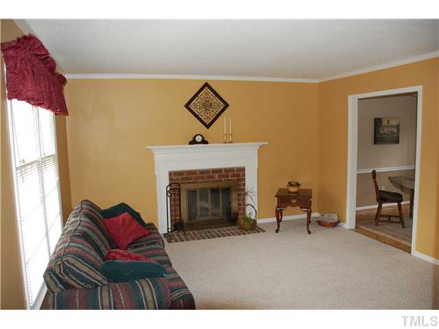 116 Wythe Circle Raleigh, NC 27615 - Photo 3 of 23 Family room / masonry fireplace