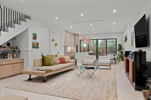 a bed room with a bed and a television