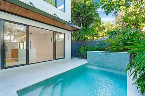 a close view of a utility room with dryer and washer