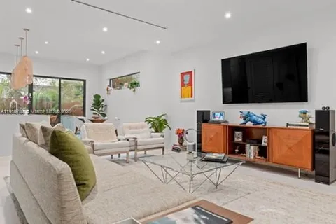 a kitchen with a table chairs and cabinets